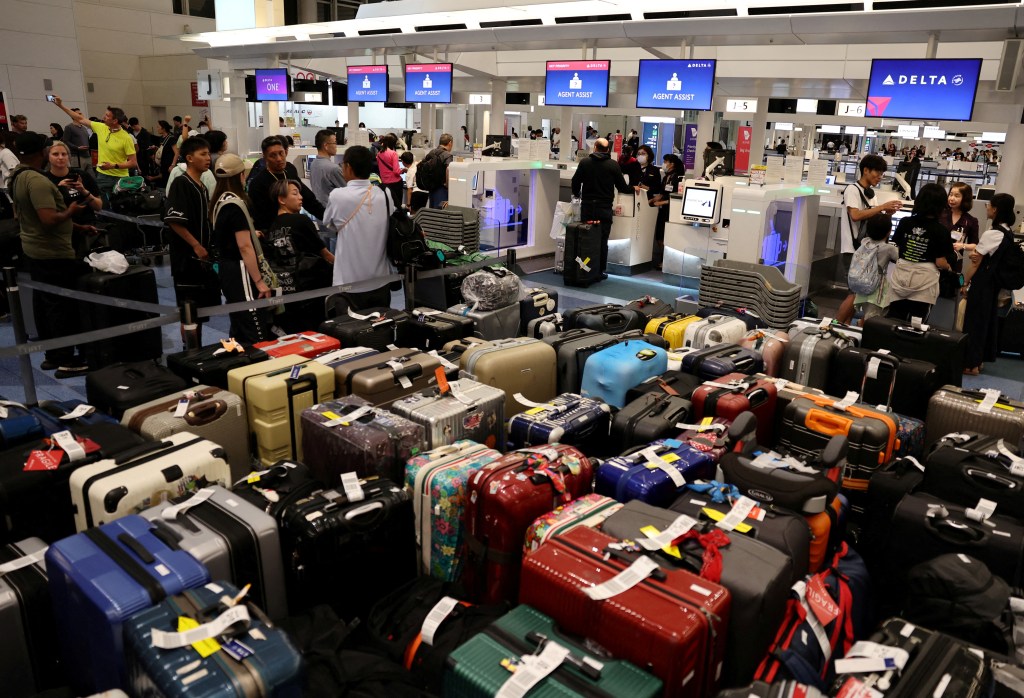 Bags and passengers at the Delta counter on July 19.